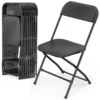 Guests seated on black and white vinyl folding chairs at an event